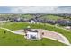 Neighborhood playground with picnic tables and play equipment surrounded by lush green grass and walkways at 8234 S Vandriver Way, Aurora, CO 80016