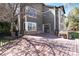 Spacious wood back deck with access to home and a black metal railing to enclose the outdoor area at 10028 Chelmsford Ter, Parker, CO 80134