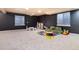Finished basement featuring neutral carpet, recessed lighting, furniture and a play area at 10028 Chelmsford Ter, Parker, CO 80134