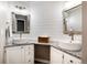 Modern bathroom featuring dual vessel sinks, granite countertop, rustic mirrors and shiplap wall at 10028 Chelmsford Ter, Parker, CO 80134