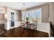 Breakfast nook with a table and chairs under a modern light fixture at 10028 Chelmsford Ter, Parker, CO 80134