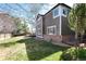 View of the rear exterior of the house showcasing the siding, brick foundation and back deck at 10028 Chelmsford Ter, Parker, CO 80134