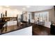 Open kitchen with stainless appliances, granite countertop, and breakfast nook at 10028 Chelmsford Ter, Parker, CO 80134