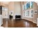 Bright living room with tall windows, hardwood floors, and lots of natural light at 10028 Chelmsford Ter, Parker, CO 80134