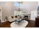Open-concept living room with fireplace, high ceilings and abundant light at 10028 Chelmsford Ter, Parker, CO 80134