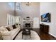 Spacious living room with a fireplace and large window at 10028 Chelmsford Ter, Parker, CO 80134