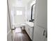 Clean bathroom features white subway tiles in shower and modern vanity at 992 Toledo St, Aurora, CO 80011