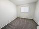 Cozy bedroom features a window for natural light and neutral carpet at 992 Toledo St, Aurora, CO 80011