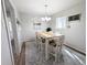 Bright dining area with a stylish table, chairs, and modern light fixture at 992 Toledo St, Aurora, CO 80011