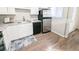 Bright kitchen features stainless steel appliances and a new black dishwasher at 992 Toledo St, Aurora, CO 80011