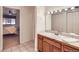 Bathroom features a wood vanity, a mirror, and is adjacent to the bedroom at 830 N Sherman St # 208, Denver, CO 80203