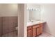 Clean bathroom features a vanity with wood cabinets and tile flooring at 830 N Sherman St # 208, Denver, CO 80203