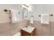 Clean, well-lit bathroom with neutral tile, vanity, and white towels at 830 N Sherman St # 208, Denver, CO 80203