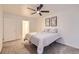 Comfortable bedroom features soft carpet, ceiling fan, and bright natural light at 830 N Sherman St # 208, Denver, CO 80203
