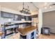Modern kitchen with stainless steel appliances and a functional island at 830 N Sherman St # 208, Denver, CO 80203