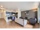 Open-concept living space with hardwood floors and combined kitchen-living area at 830 N Sherman St # 208, Denver, CO 80203