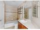 Bathroom featuring a shower-tub combo with tile, a toilet, vanity and mirrored wall cabinet at 16643 E 101St Ave, Commerce City, CO 80022