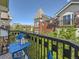 Charming balcony with views of surrounding architecture and lush greenery at 30 Garfield St # B, Denver, CO 80206