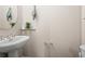 Stylish half bathroom with modern fixtures, vessel sink, and neutral color palette at 30 Garfield St # B, Denver, CO 80206