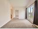 Spacious bedroom with ample natural light, balcony access, and mirrored closet doors at 30 Garfield St # B, Denver, CO 80206