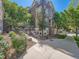 Brick exterior of townhome with well-maintained landscaping, stone accents, and inviting entrance at 30 Garfield St # B, Denver, CO 80206