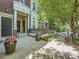 Inviting front porch with decorative planters and a well-maintained entryway at 30 Garfield St # B, Denver, CO 80206