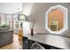 Comfortable home office space with large windows, desk space, and access to the living room at 30 Garfield St # B, Denver, CO 80206