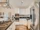 Modern kitchen features stainless steel appliances, granite countertops, and sleek white cabinetry at 30 Garfield St # B, Denver, CO 80206
