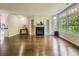 Open living room featuring a fireplace, built-in shelves, and plenty of natural light at 30 Garfield St # B, Denver, CO 80206