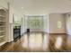 Spacious living room features hardwood floors, a fireplace, and large windows letting in ample natural light at 30 Garfield St # B, Denver, CO 80206