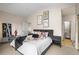 Bright main bedroom with ensuite bathroom, walk-in closet, and large window for natural light at 30 Garfield St # B, Denver, CO 80206