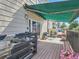 Inviting outdoor patio with an awning and comfortable seating, perfect for relaxation at 30 Garfield St # B, Denver, CO 80206