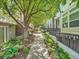 Charming street view with lush landscaping and well-maintained sidewalks at 30 Garfield St # B, Denver, CO 80206