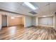 Spacious finished basement with wood laminate flooring, offering versatile living or recreational space at 7294 S Syracuse St, Centennial, CO 80112
