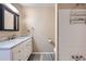 Bathroom featuring a vanity with marble countertop, updated fixtures, and a tiled shower area at 7294 S Syracuse St, Centennial, CO 80112