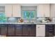 Close-up of kitchen area, granite countertop, stainless steel appliances, and under cabinet lighting at 7294 S Syracuse St, Centennial, CO 80112