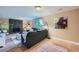 Cozy living room featuring a stone fireplace, stylish decor, and hardwood floors at 7294 S Syracuse St, Centennial, CO 80112