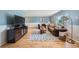 Comfortable living room with hardwood floors, plenty of light, and stylish furniture at 7294 S Syracuse St, Centennial, CO 80112