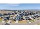 Aerial view showing a residential neighborhood with mountain views in the distance at 117 Nova Ct, Erie, CO 80516
