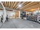 Finished basement space, ideal for a home gym, featuring weights and exercise equipment at 117 Nova Ct, Erie, CO 80516