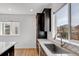 Well-lit kitchen features stainless steel sink, granite countertops, and dark brown wood cabinetry at 117 Nova Ct, Erie, CO 80516