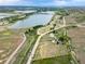 Expansive aerial view of property with surrounding lakes and natural landscape at 14831 Riverdale Rd, Brighton, CO 80602