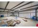 Interior view of large barn with steel beams and concrete floor at 14831 Riverdale Rd, Brighton, CO 80602