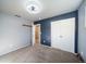 Bedroom featuring new carpet, fresh paint and sliding closet doors at 14831 Riverdale Rd, Brighton, CO 80602