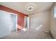 Bedroom featuring a modern light fixture, new carpet and closet at 14831 Riverdale Rd, Brighton, CO 80602