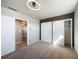 Bright bedroom featuring new carpet and a modern ceiling fan at 14831 Riverdale Rd, Brighton, CO 80602
