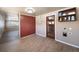Laundry room with wood-look flooring, utility sink and lots of natural light at 14831 Riverdale Rd, Brighton, CO 80602