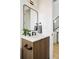 Modern bathroom vanity with wood cabinets and a quartz countertop at 4490 W 45Th Ave, Denver, CO 80212