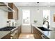 Modern kitchen with stainless steel appliances and wood cabinets at 4490 W 45Th Ave, Denver, CO 80212