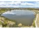 Aerial view of a lake with walking paths and lush green surroundings at 4490 W 45Th Ave, Denver, CO 80212